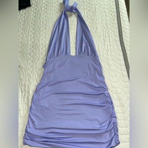 A open back purple dress.